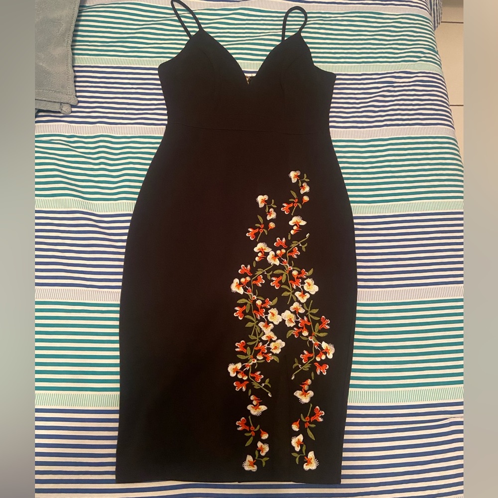 Black evening dress with floral print.